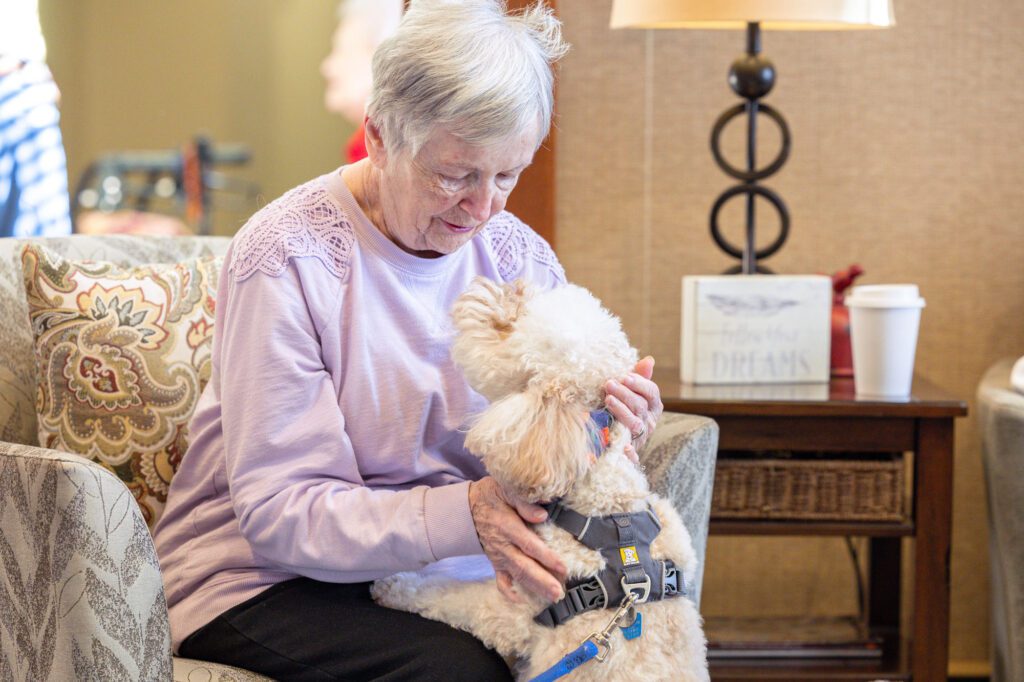 Photo of resident with dog