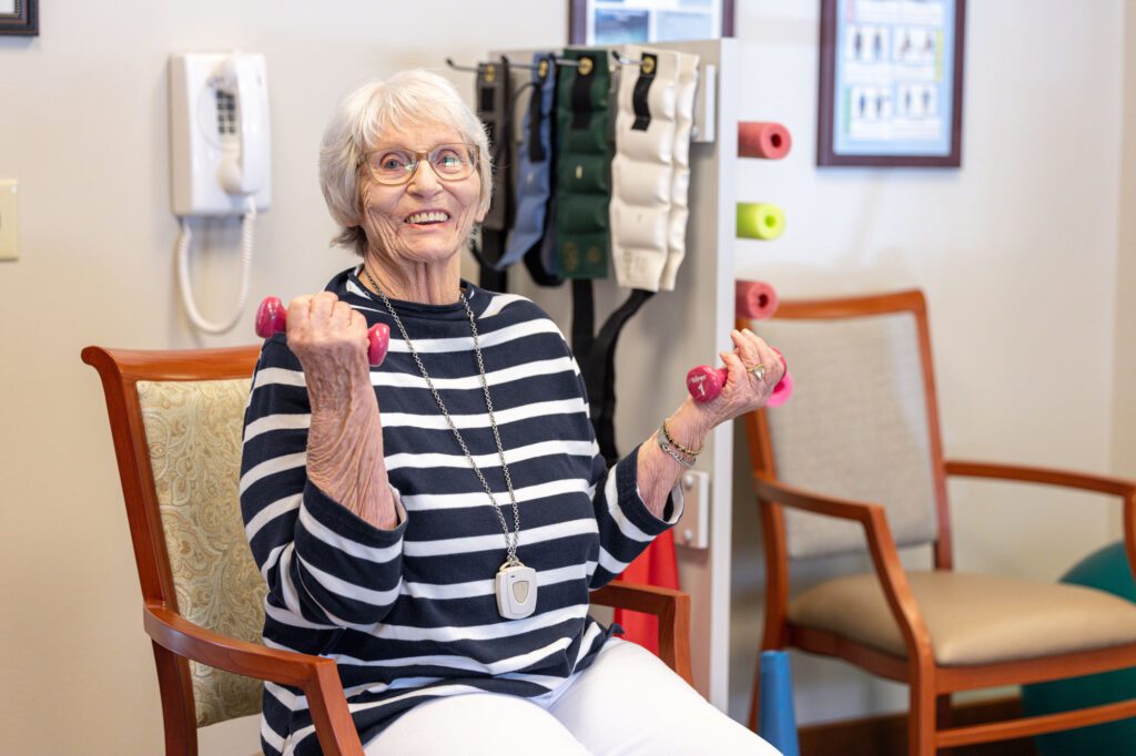 Photo of resident lifting weights